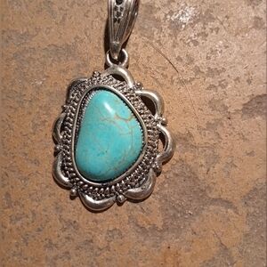 Turquoise and silver pendant